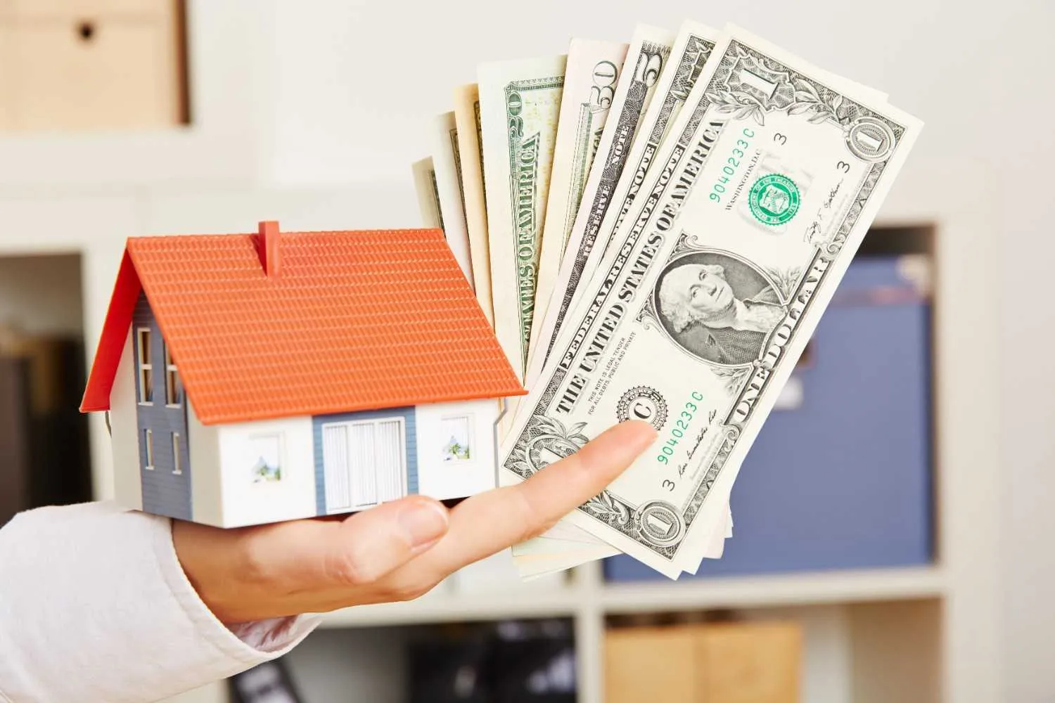 Homeowners reviewing a cash offer at their kitchen table
